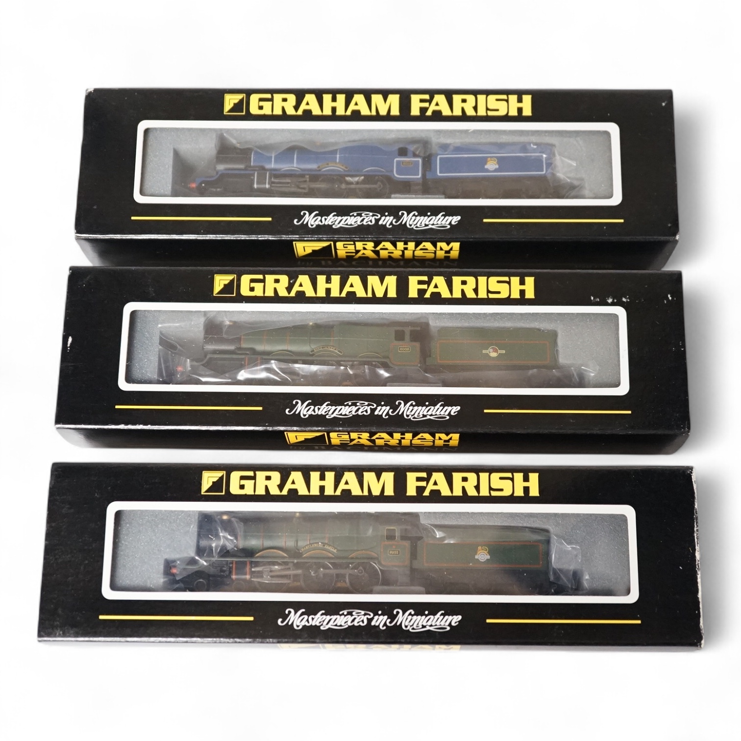 Three boxed Graham Farish N gauge railway BR locomotives; a Castle Class, 7033 Hartlebury Castle (372025), and two King Class, 6021 King Richard II (372550) and 6008 King James II (372551). Condition - good.